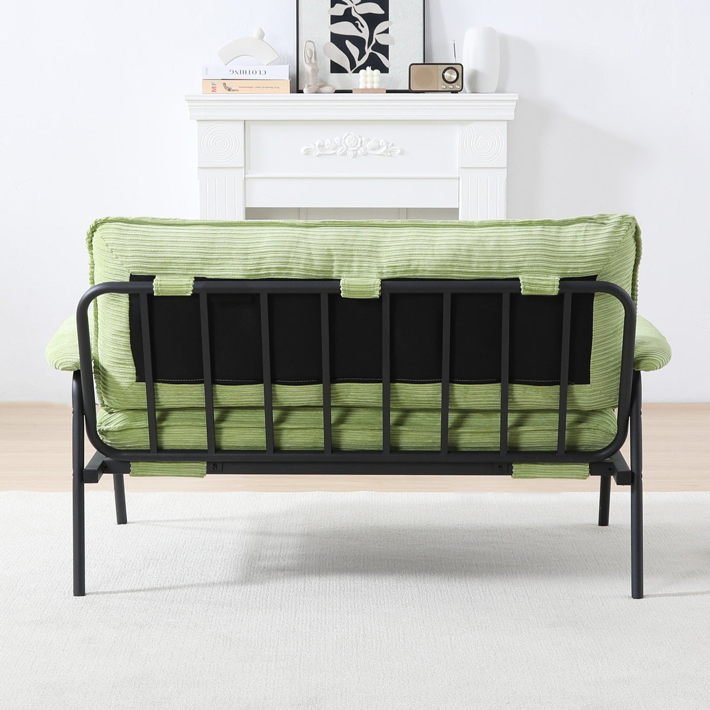 The 53-inch green sofa offers a spacious layout in the small apartment, easily handling various scenarios from watching movies to working
