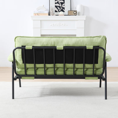 The 53-inch green sofa offers a spacious layout in the small apartment, easily handling various scenarios from watching movies to working
