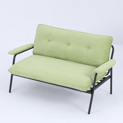 The 53-inch green sofa offers a spacious layout in the small apartment, easily handling various scenarios from watching movies to working