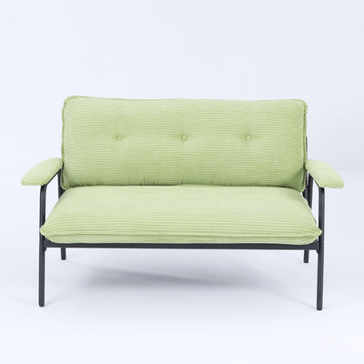 The 53-inch green sofa offers a spacious layout in the small apartment, easily handling various scenarios from watching movies to working