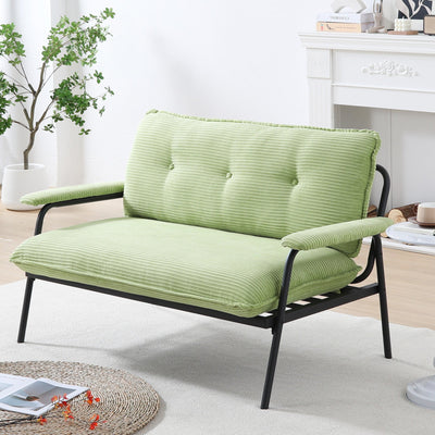 The 53-inch green sofa offers a spacious layout in the small apartment, easily handling various scenarios from watching movies to working
