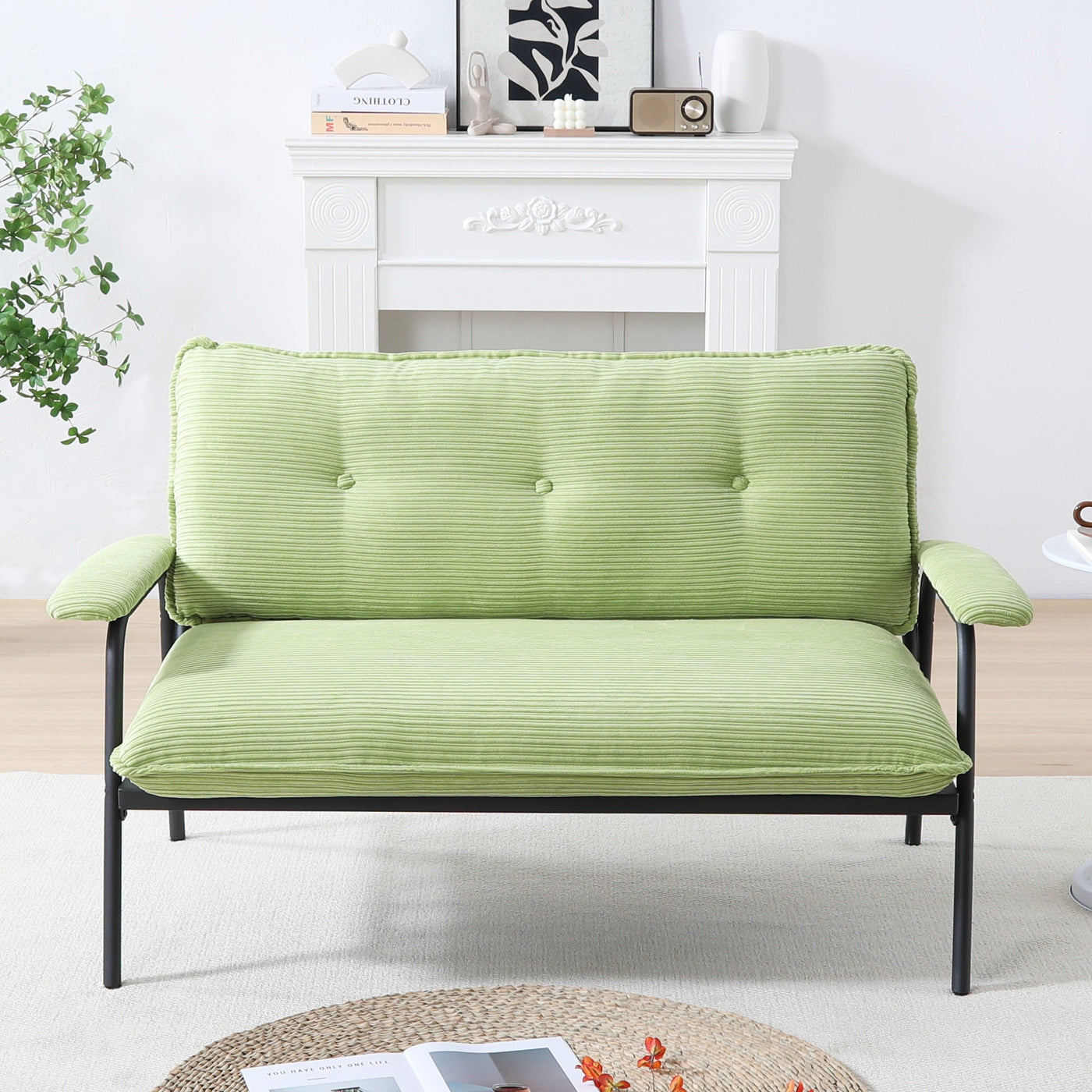 The 53-inch green sofa offers a spacious layout in the small apartment, easily handling various scenarios from watching movies to working