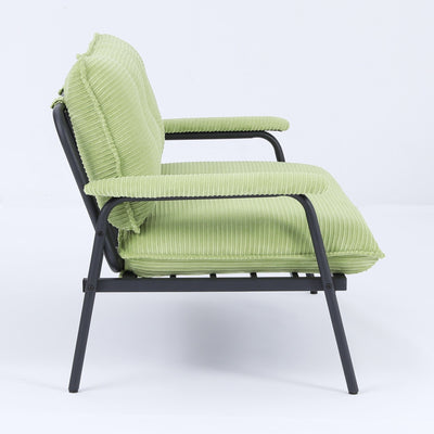 The 53-inch green sofa offers a spacious layout in the small apartment, easily handling various scenarios from watching movies to working